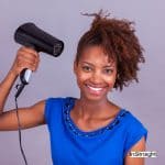 lady in blue shirt blow dry black hair